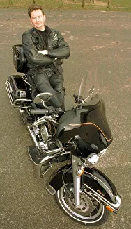 John Gordon Sinclair actor leaning back on his Harley Davidson Electra Glide motorcycle John Gordon Sinclair actor leaning back on his Harley Davidson Electra Glide motorcycle