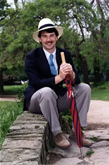 John Kettley TV Weather Forecaster Presenter on BBC TV sitting on small bridge wall John Kettley TV Weather Forecaster Presenter on BBC TV sitting on small bridge wall