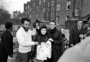 John Lennon and Yoko pictured on the roof of Black House in Holloway Road, with Michael X John Lennon and Yoko pictured on the roof of Black House in Holloway Road, with Michael X
