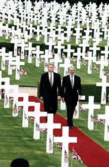 John Major MP Prime Minister walking through a War Cemetery with President Bill Clinton John Major MP Prime Minister walking through a War Cemetery with President Bill Clinton