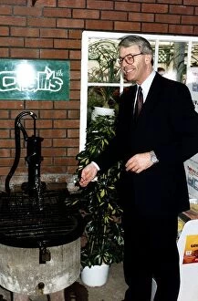 Images Dated 29th March 1992: John Major Prime Minister throwing money into a wishing well during the 1992 election