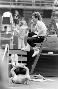 John McEnroe, with a foot bandaged and leather support seen here during training running John McEnroe, with a foot bandaged and leather support seen here during training running