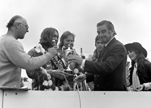 Images Dated 13th August 1977: John Player British Grand Paix, Silverstone. Ron Haslam being presented with