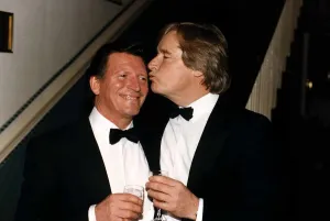 Johnny Briggs Actor gets a kiss from Bil Roache at a party Johnny Briggs Actor gets a kiss from Bil Roache at a party