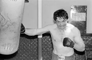 Johnny Frankham Boxer May 1975 hitting punchbag in his training gym traing for his next Johnny Frankham Boxer May 1975 hitting punchbag in his training gym traing for his next