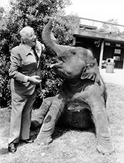 Johnny Morris TV Presenter of Animal Programmes with Layang the Elephant at an Animal Johnny Morris TV Presenter of Animal Programmes with Layang the Elephant at an Animal