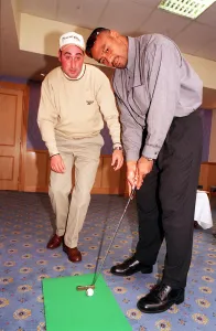Jonah Lomu Rugby player October 1999 playing golf putting Receiving lesson from Kevin Jonah Lomu Rugby player October 1999 playing golf putting Receiving lesson from Kevin