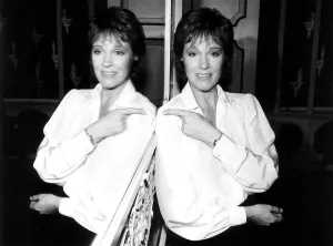 Julie Andrews Actress and Singer at London Airport LAP pointing at her reflection in Julie Andrews Actress and Singer at London Airport LAP pointing at her reflection in
