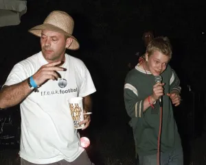 Keith Allen and son Alfie Allen singing Kareoke June 1999 at the Glastonbury Keith Allen and son Alfie Allen singing Kareoke June 1999 at the Glastonbury