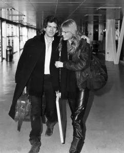 Keith Richards guitarist with the Rolling Stones leaving Heathrow with his girlfriend Keith Richards guitarist with the Rolling Stones leaving Heathrow with his girlfriend