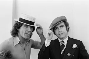 Kevin Keegan in a straw boater hat and Elton John in his own hat Kevin Keegan in a straw boater hat and Elton John in his own hat