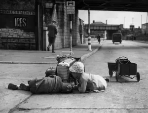Two kids playing with their cars on the Barry Road, Cardiff. 16th June 1943 Two kids playing with their cars on the Barry Road, Cardiff. 16th June 1943