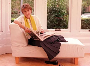 Kirsty Wark October 1999 TV Presenter reading a book on a sofa in her home Kirsty Wark October 1999 TV Presenter reading a book on a sofa in her home