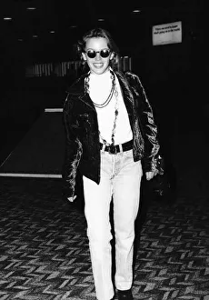 Kylie Minogue singer actress in dark glasses and leather jacket at Heathrow Airport Kylie Minogue singer actress in dark glasses and leather jacket at Heathrow Airport