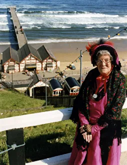 A lady poses by Saltburn Pier in Victorian clothing. 18th August 1991 A lady poses by Saltburn Pier in Victorian clothing. 18th August 1991