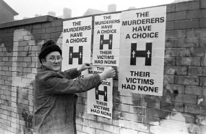 Launch Of Poster Campaign To Highlight Victims Plight Mr Tom Passmore putting up Launch Of Poster Campaign To Highlight Victims Plight Mr Tom Passmore putting up
