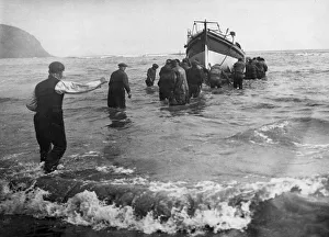 Launching the lifeboat at Robin Hood's Bay near Whitby in North Yorkshire to rescue Launching the lifeboat at Robin Hood's Bay near Whitby in North Yorkshire to rescue