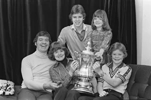 Laurie McMenemy with his wife and children holding the FA Cup at their home 14/2/77 Laurie McMenemy with his wife and children holding the FA Cup at their home 14/2/77