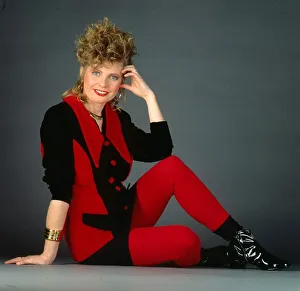 Lee Hepburn actress February 1991. Sitting on floor black red outfit earrings Lee Hepburn actress February 1991. Sitting on floor black red outfit earrings