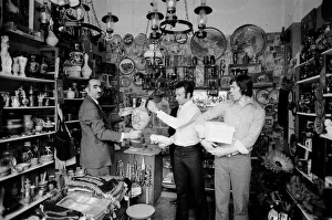 Leeds United players buying gifts in a local shop as they take a walk around the town of Leeds United players buying gifts in a local shop as they take a walk around the town of