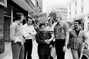 Leeds United players meet a local man with a huge moustache as they take a walk around Leeds United players meet a local man with a huge moustache as they take a walk around