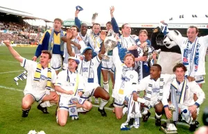 Leeds United team celebrate with the league division one championship trophy Leeds United team celebrate with the league division one championship trophy