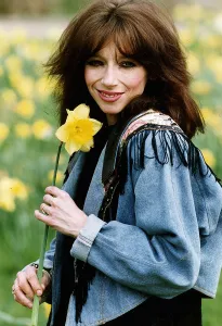 Lena Zavaroni singer with daffodil flower outisde her house in London. April 1993 Lena Zavaroni singer with daffodil flower outisde her house in London. April 1993