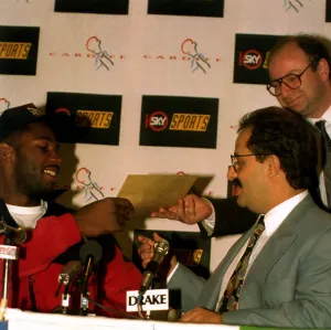 Lennox Lewis former World Heavyweight Boxing Champion being handed a writ by Frank Lennox Lewis former World Heavyweight Boxing Champion being handed a writ by Frank