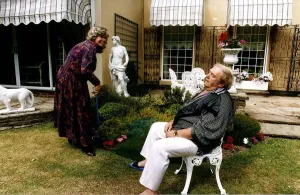 Les Dawson Comedian with wife in garden pretending he is exhausted Les Dawson Comedian with wife in garden pretending he is exhausted