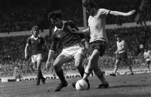 Liam Brady of Arsenal is tackled by Ipswich defender 1978 in the FA Cup Final at Liam Brady of Arsenal is tackled by Ipswich defender 1978 in the FA Cup Final at
