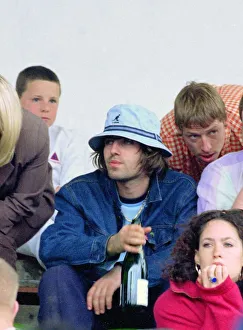 Liam Gallagher drinking wine - May 1996 Oasis v Blur football match Played at Liam Gallagher drinking wine - May 1996 Oasis v Blur football match Played at