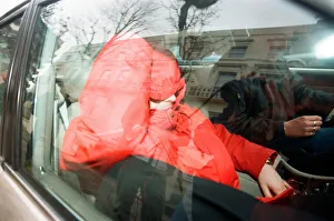 Liam Gallagher from Oasis (in red) leaving his London home Liam Gallagher from Oasis (in red) leaving his London home