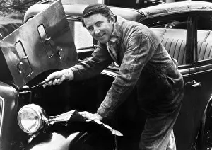 Liberal Party Leader David Steel MP, wearing overalls as he makes repairs to his motor Liberal Party Leader David Steel MP, wearing overalls as he makes repairs to his motor
