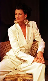 Linda Evangelista at Paris Fashion Week 1997 models a stunning cream trouser suit with Linda Evangelista at Paris Fashion Week 1997 models a stunning cream trouser suit with