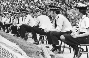 A line of policemen and women control the Newcastle United fans at St James Park 21 A line of policemen and women control the Newcastle United fans at St James Park 21