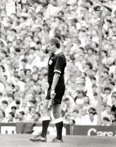 Linesman signals Referee after bottle thrown at him during the Arsenal v Manchester Linesman signals Referee after bottle thrown at him during the Arsenal v Manchester
