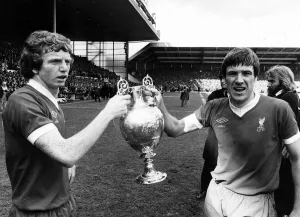 Liverpool captain Emlyn Hughes and David Fairclough celebrate with the League Liverpool captain Emlyn Hughes and David Fairclough celebrate with the League
