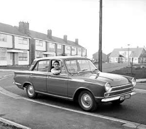 00236 Collection: Liverpool footballer Ian St. John with his new Ford Cortina in Liverpool