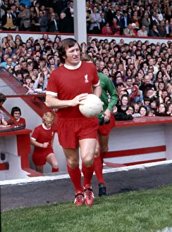 Liverpool footballer Tommy Smith waks on to the pitch before a league division one match Liverpool footballer Tommy Smith waks on to the pitch before a league division one match