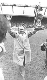 Liverpool Manager Bob Paisley holding up the League Championship trophy to the Anfield Liverpool Manager Bob Paisley holding up the League Championship trophy to the Anfield