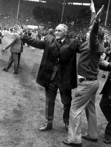 Liverpool manager Bill Shankly celebrates on the picth at Wembley following his side' Liverpool manager Bill Shankly celebrates on the picth at Wembley following his side'