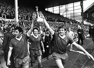 Liverpool players Ray Kennedy (L) and Emlyn Hughes celebrate with the League Championship Liverpool players Ray Kennedy (L) and Emlyn Hughes celebrate with the League Championship