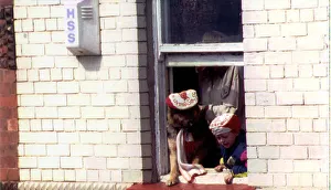 Liverpool return after winning FA Cup. OPS Fans with their dog cheering from a window Liverpool return after winning FA Cup. OPS Fans with their dog cheering from a window