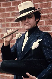 Liverpool star Ray Kennedy smoking a cigar dressed as Chicago gangster Al Capone Liverpool star Ray Kennedy smoking a cigar dressed as Chicago gangster Al Capone