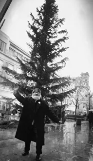 Liverpool Street musician Augustus Broll does a jig around the Christmas tree in Church Liverpool Street musician Augustus Broll does a jig around the Christmas tree in Church
