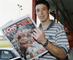 Liverpool striker Robbie Fowler reading the Liverpool Echo Special Celebration Souvenir Liverpool striker Robbie Fowler reading the Liverpool Echo Special Celebration Souvenir