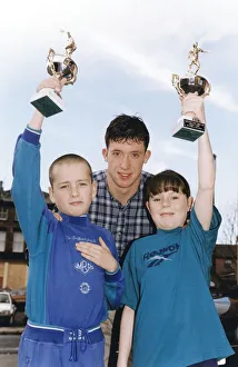 Liverpool's Robbie Fowler handing out prizes to youngsters Steven Beck (Prince Liverpool's Robbie Fowler handing out prizes to youngsters Steven Beck (Prince