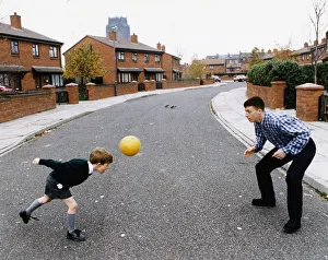 Liverpool's young teen sensation Robbie Fowler plays football with six-year old Scott Liverpool's young teen sensation Robbie Fowler plays football with six-year old Scott