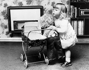 Louise Brown Test Tube Girl playing with doll and dolls pram June 1980 Louise Brown Test Tube Girl playing with doll and dolls pram June 1980
