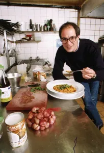 Loyd Grossman TV Presenter of Master Chef in his wn kitchen trying out his own cooking Loyd Grossman TV Presenter of Master Chef in his wn kitchen trying out his own cooking